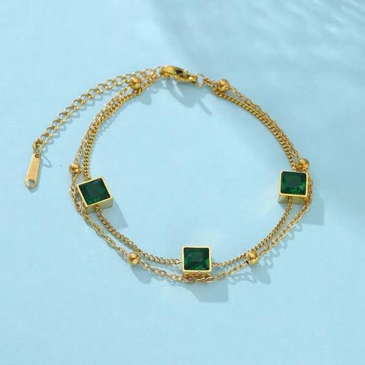 Elegant Gold Bracelet with Green Square Gemstones