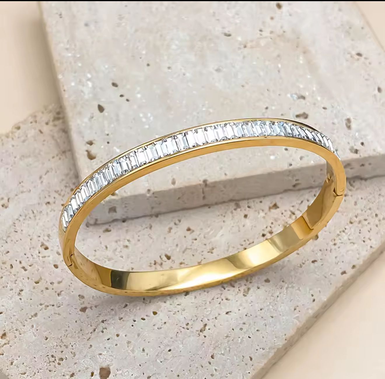 Elegant Gold Bangle with Baguette-Cut Zircon Stones