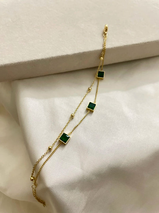 Elegant Gold Bracelet with Green Square Gemstones